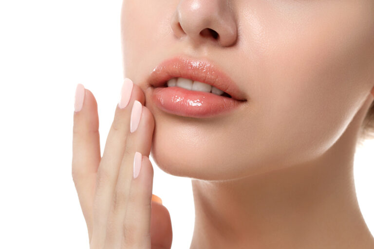 Image of woman's lips wearing lip gloss